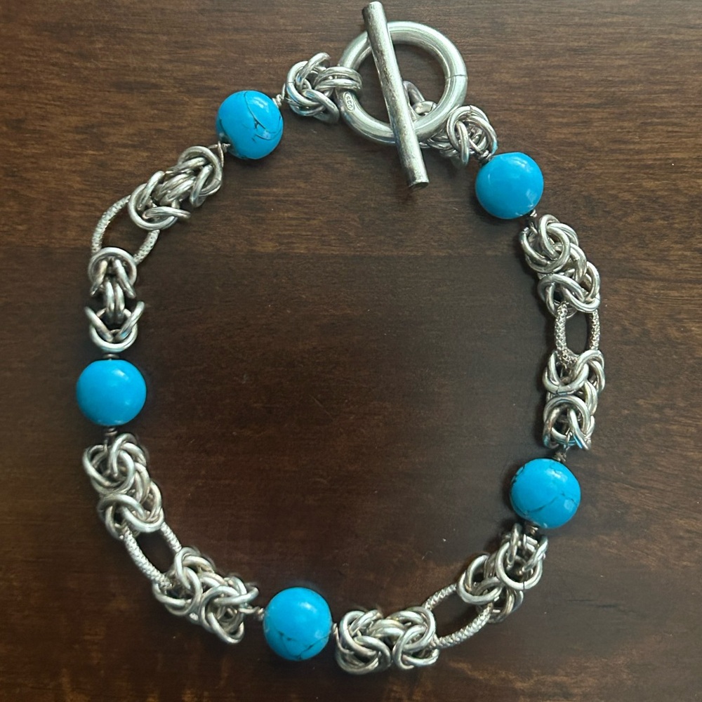 Beautuful sterling silver Byzantine chain bracelet with turquoise colored beads.
